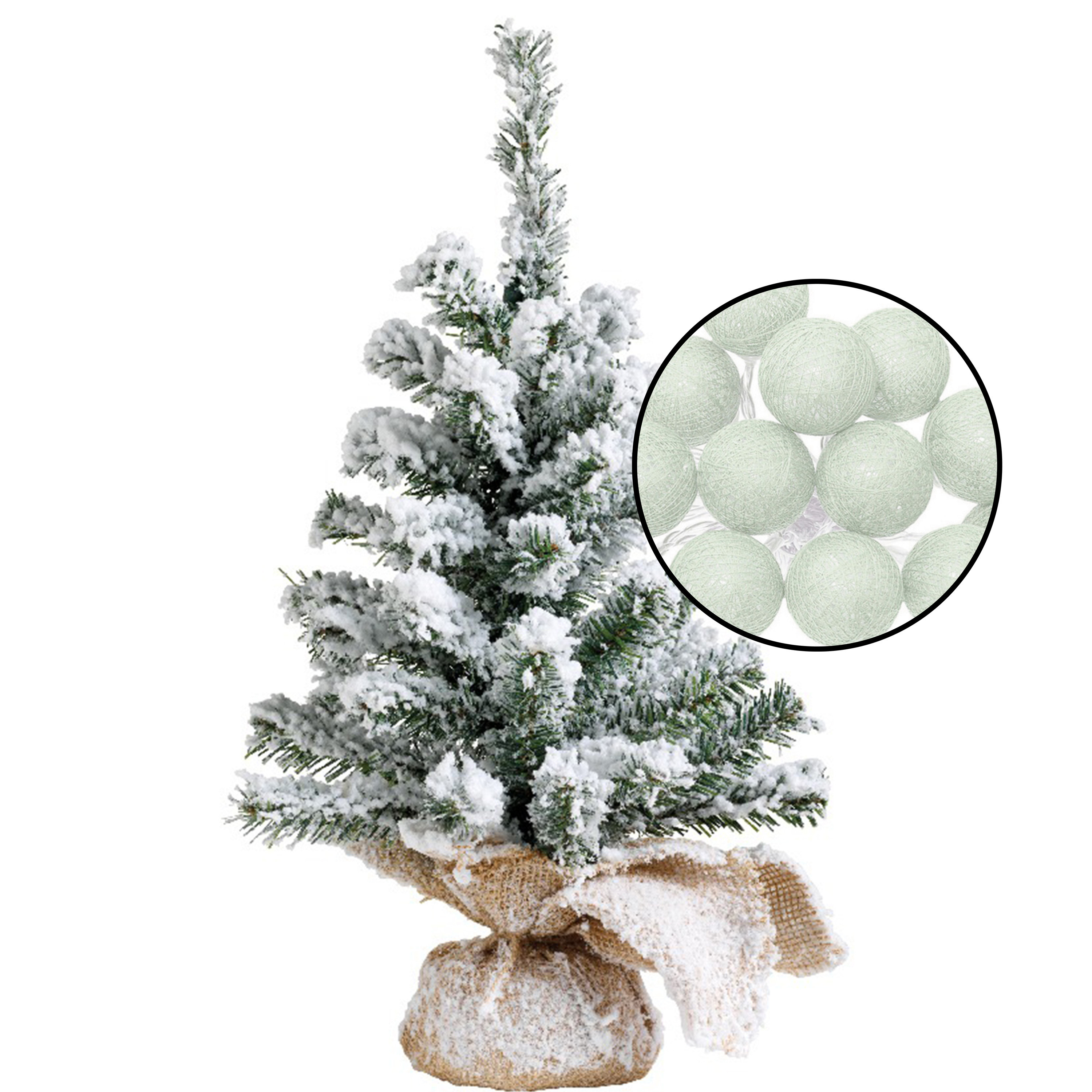 Mini kerstboom besneeuwd met verlichting in jute zak H45 cm lichtgroen